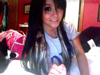 Illustration for article titled Snooki Got Leopard Print Hair Extensions